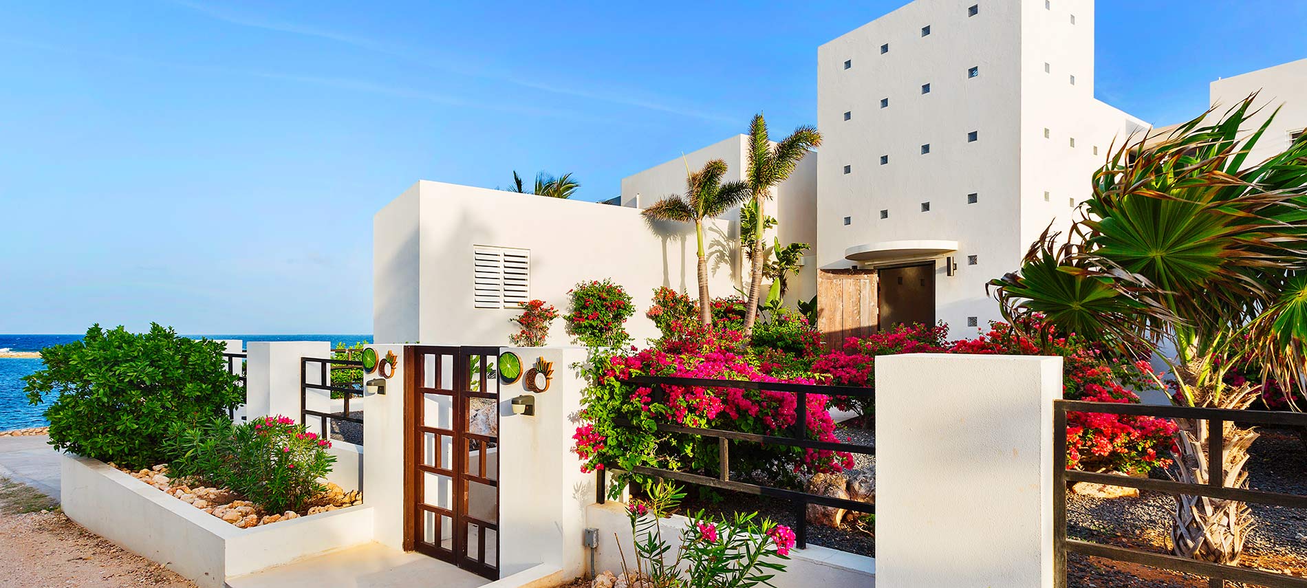 Limin' Da Coconut Villa on Anguilla features a dramatic entry with lush gardens.